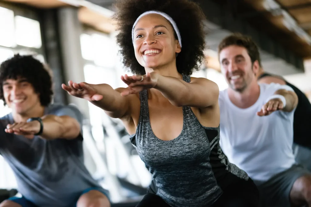 Group fitness class engaging in light exercise after LASIK surgery, emphasizing safe indoor workouts post-surgery in Wayne, PA